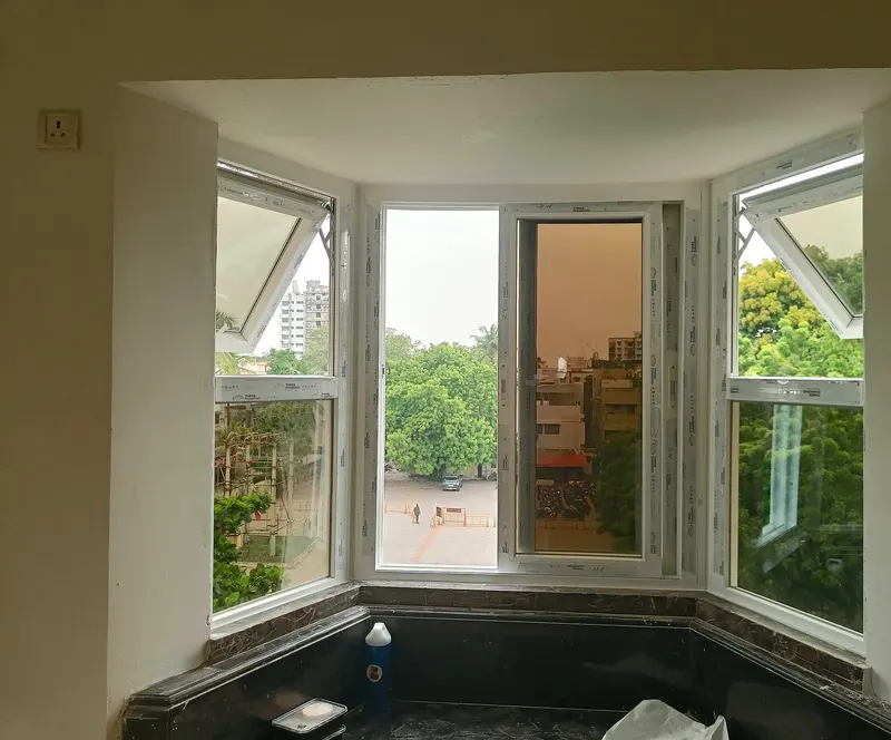 Semi-hexagonal bay window with its top-hung vents open