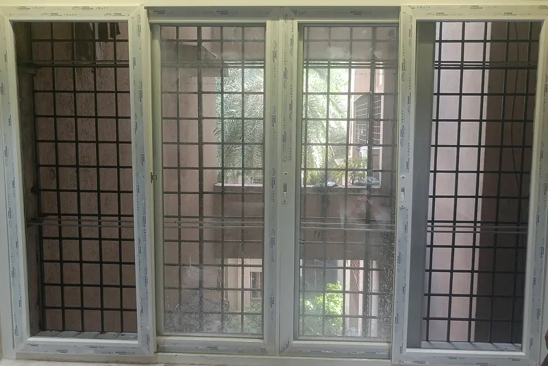 Four-panel uPVC window with two openable sashes and two mesh panels
