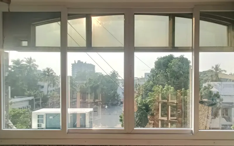 Wide uPVC window with arched fixed top lights
